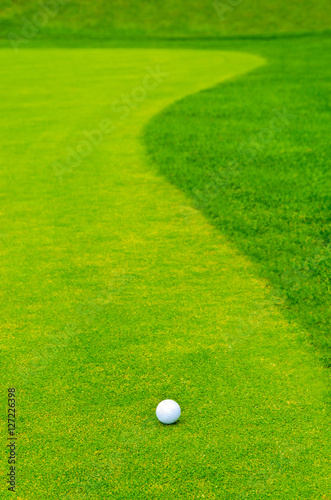 Golf ball on green tee