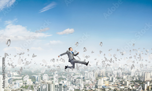 Wallpaper Mural Businessman jumping high Torontodigital.ca