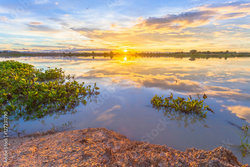 Fototapeta Naklejka Na Ścianę i Meble -  Sunset over lake at countryside