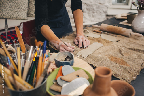 Pottering process.Dirty hands creating dishes