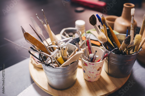 Working place of potter master with accessories