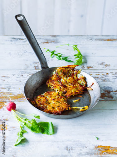 Frying pan with potato roesti photo