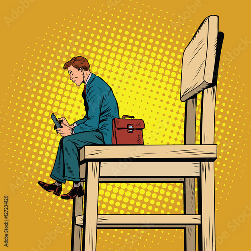 Small business man on the big chair, and smartphone