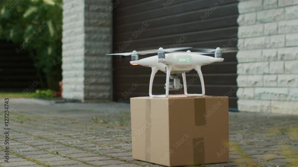Flying Drone Delivers Postal Package Right To Your Porch. Shot on RED Cinema Camera in 4K (UHD).
