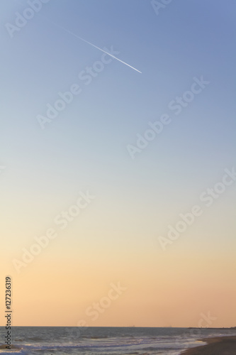 twilight sky gradient with jet trails