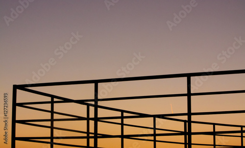 structure silhouette against the sky at dusk