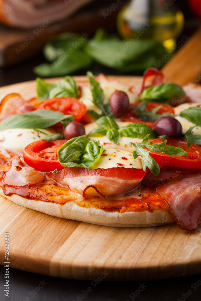 Delicious pizza with bacon and mozzarella cheese