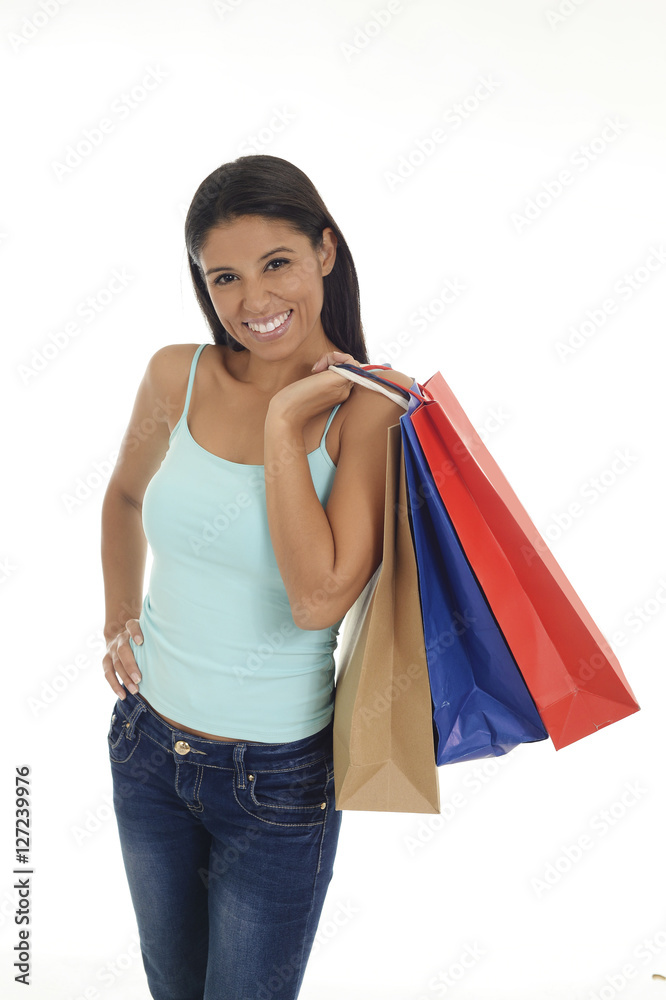 young happy and beautiful hispanic woman holding color shopping bags smiling excited isolated young happy and beautiful hispanic woman holding color shopping bags smiling excited isolated