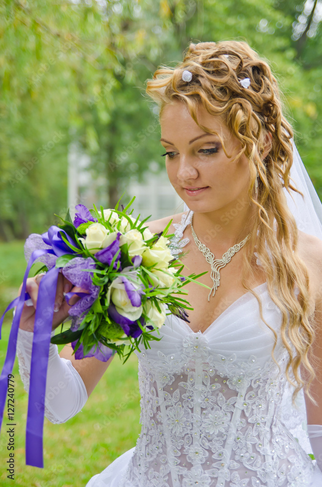 Fototapeta premium Wedding bouquet in hand charming bride.