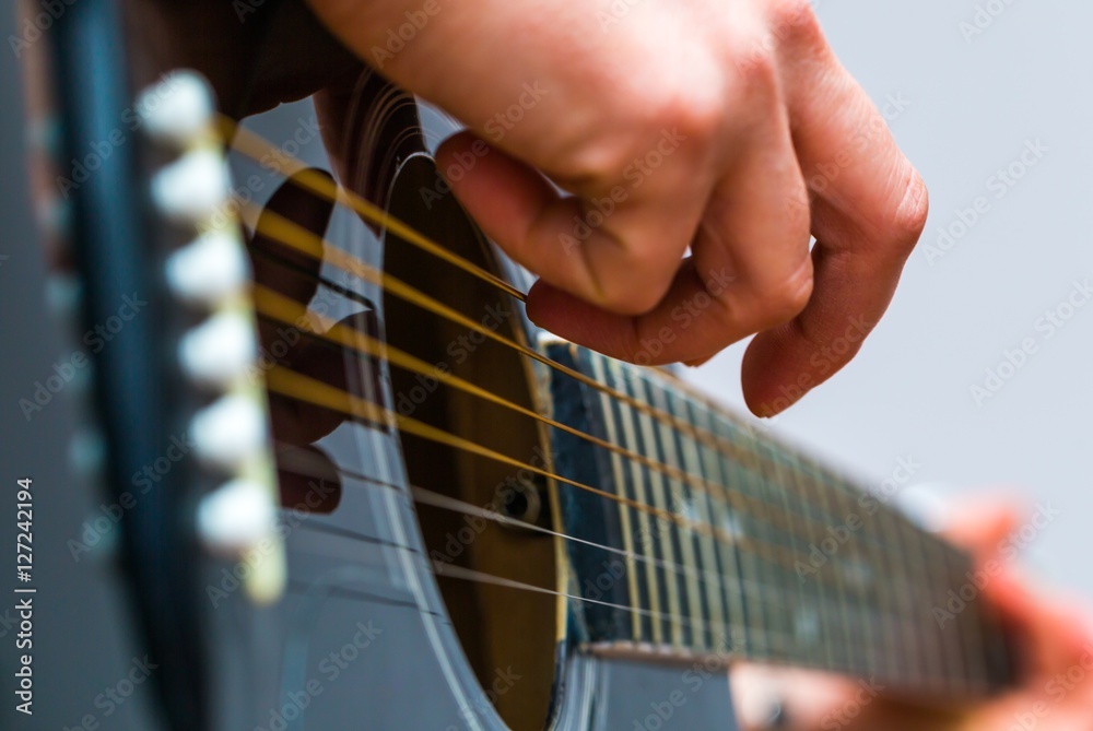 Fototapeta premium Woman hands and black acoustic guita