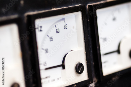 Konstfotografi voltmters,ammeters,hertz meter(Hz.)on black background.