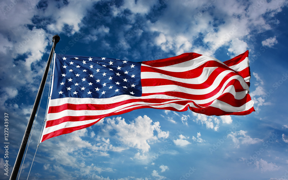 American flag on blue sky with beauty clouds American flag on blue sky with beauty clouds