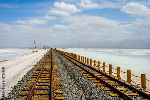 Old railway at Chaqia (Chakayan) salt lake, Qinghai, China photo