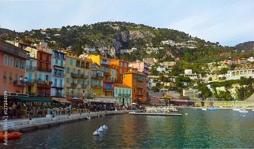 Colorful buildings with traditional architecture near the harbor of Villefranche sur Mer, French Riviera, France