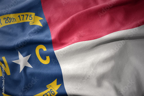 waving colorful flag of north carolina state. photo