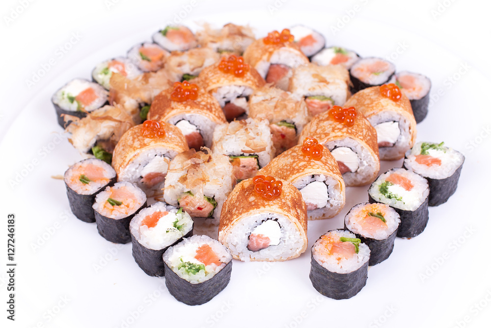 Japanese food restaurant, sushi maki gunkan roll plate or platter set. California rolls with salmon. isolated at white background. Top view, flat lay. Japanese food restaurant, sushi maki gunkan roll plate or platter set. California rolls with salmon. isolated at white background. Top view, flat lay.