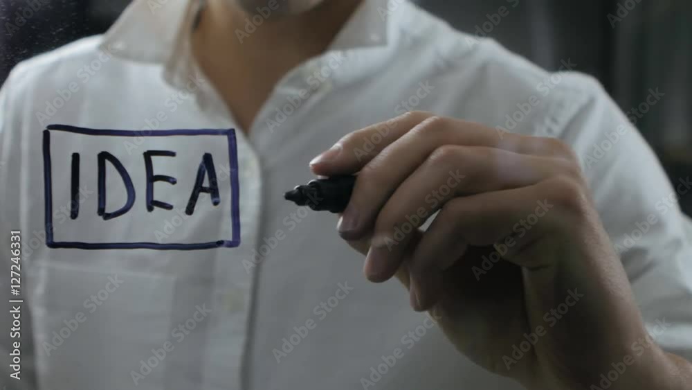 man writing a business strategy man writing a business strategy
