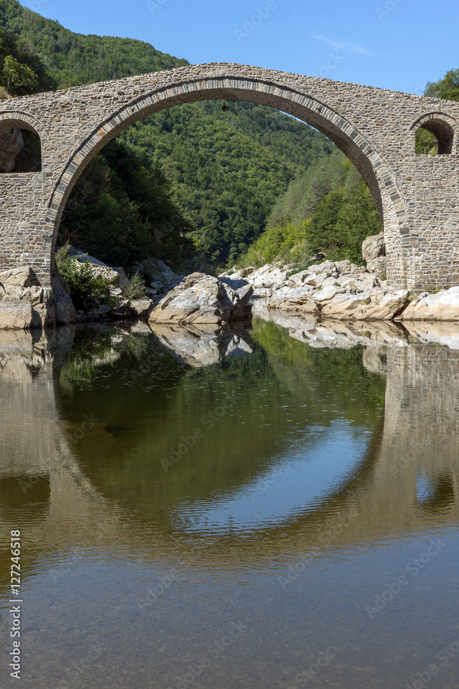 Reflection of Devil's Bridge and Rhodopes mountain in Arda river, Kardzhali Region, Bulgaria 