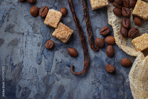 Fotografie Brown cane sugar, coffee beans and  vanilla pods