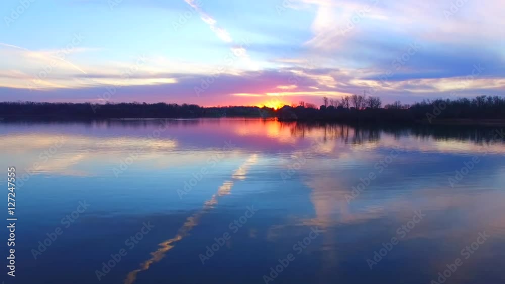 Stunning aerial journey over watery wilderness at dawn; flock of Canadian Geese awaiting the sunrise.
Stunning aerial journey over watery wilderness at dawn; flock of Canadian Geese awaiting the sunrise.