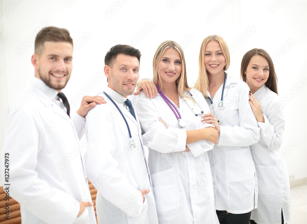 Team of medical professionals looking at camera, smiling. Team of medical professionals looking at camera, smiling.