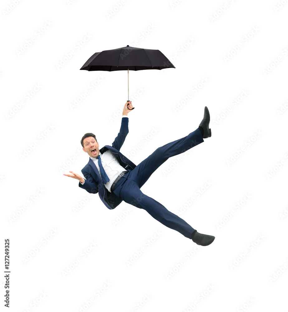 Image of businessman holding umbrella and flying on a white background