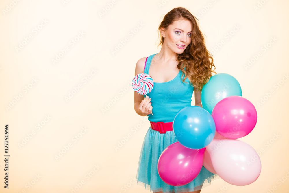 Woman with colorful balloons and lollipop Woman with colorful balloons and lollipop