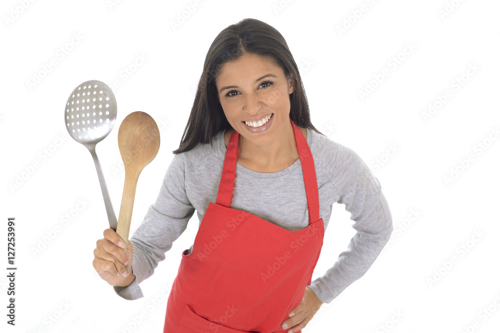 corporate portrait of young attractive hispanic home cook woman in red apron posing happy and smiling isolated corporate portrait of young attractive hispanic home cook woman in red apron posing happy and smiling isolated