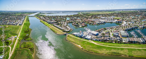 Aerial panorama of Patterson River and Patterson Lakes suburb on bright sunny day. Melbourne, Victoria, Australia photo