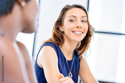 Young businesswoman sitting at desk and working