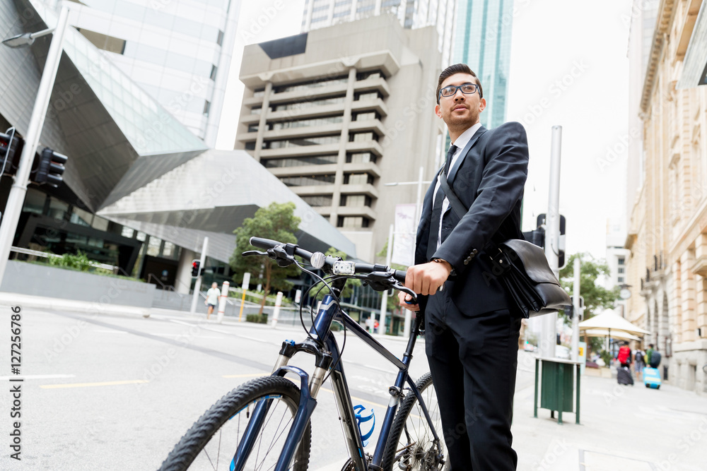 Young businessmen with a bike