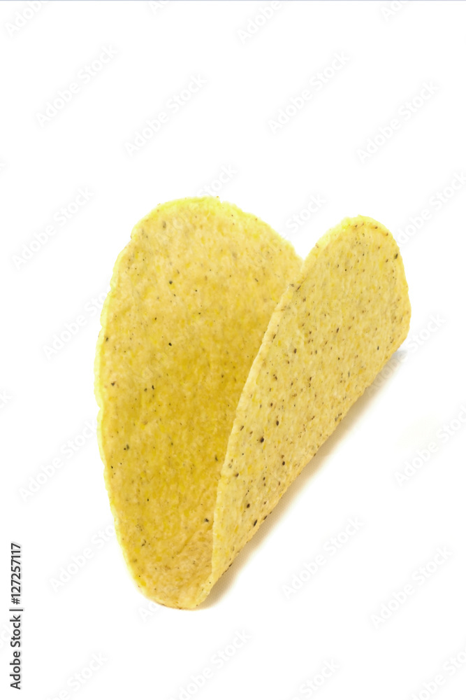 Isolated empty corn tortilla taco shell. Horizontal. Isolated empty corn tortilla taco shell. Horizontal.