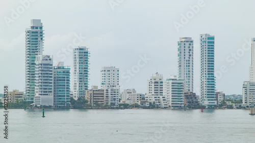 Waterfront Luxury Resedential Apartment Buildings in Cartagena Colombia with Boats in the Foreground Harbor photo