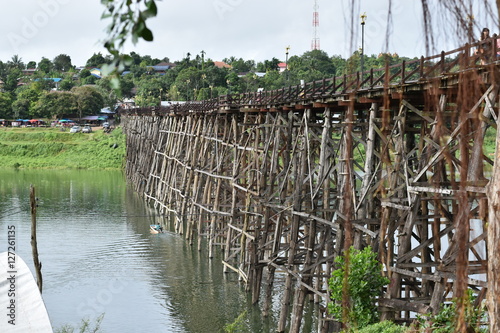Travel landscape: Mon wooden bridge against blue sky at Sangklaburi, Thailand