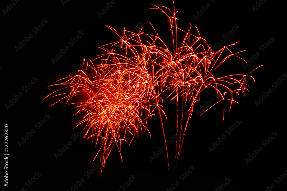Fireworks in the night.New Year celebration fireworks,Colorful fireworks over dark sky, displayed during a celebration event Fireworks in the night.New Year celebration fireworks,Colorful fireworks over dark sky, displayed during a celebration event
