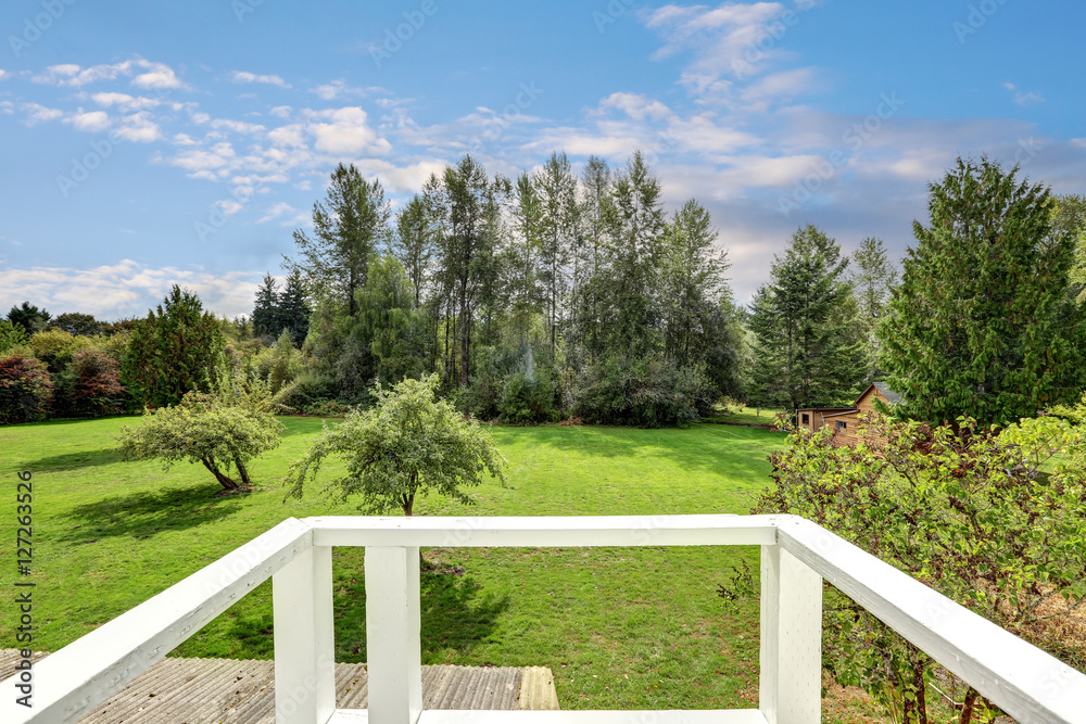 Backyard view with lots of greenery from house balcony Backyard view with lots of greenery from house balcony