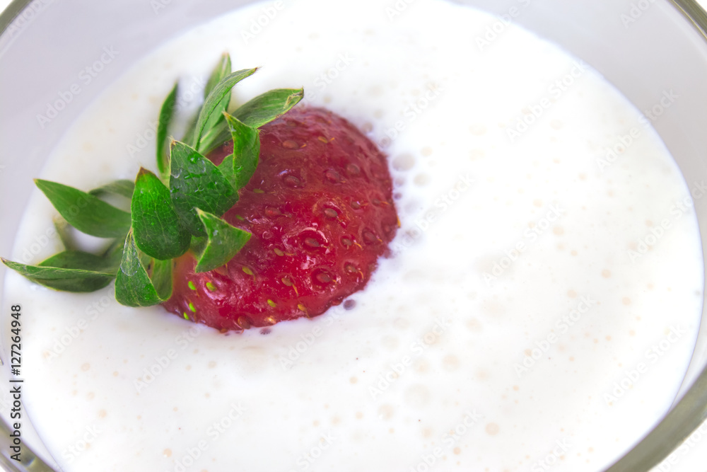 ripe strawberries in a thick sweet yogurt ripe strawberries in a thick sweet yogurt