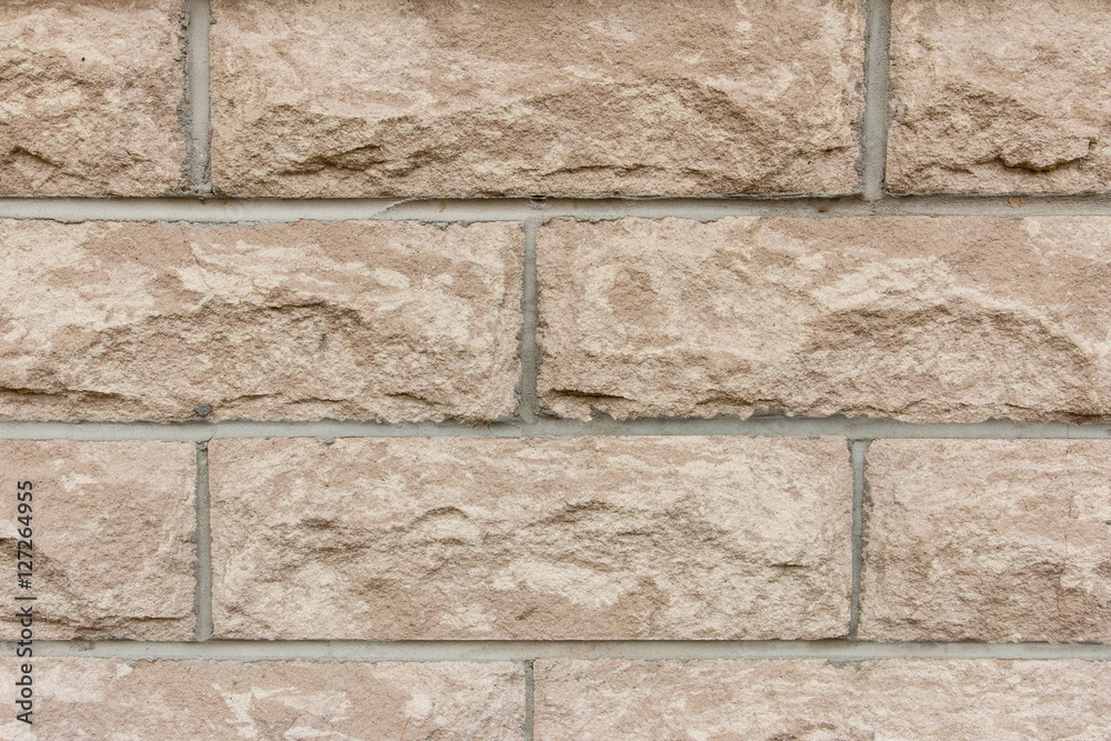 Fototapeta premium Light brown brick wall background.