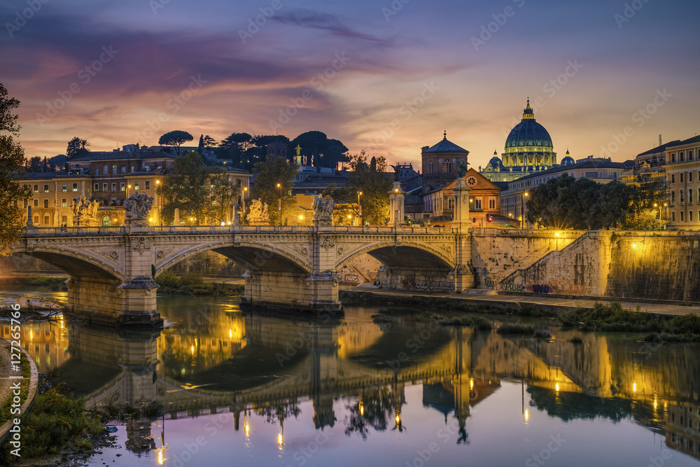 St. Peter's cathedral (Basilica di San Pietro) and bridge (Ponte Vittorio Emanuele II) over river Tiber in the evening after sunrise, Rome, Italy, Europe