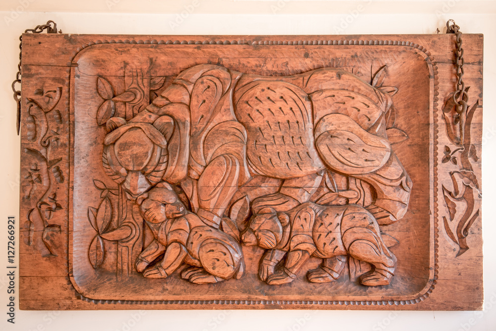 Picture carved in wood with bears