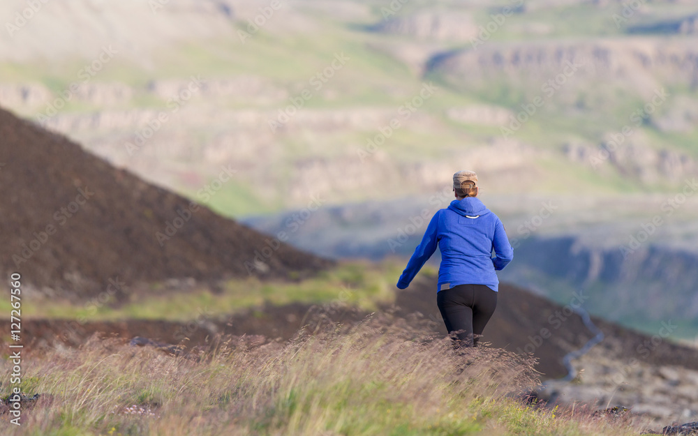 Shot of a young woman hiking in Iceland
