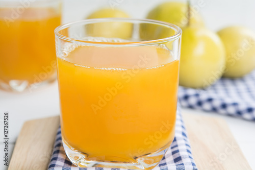 passion fruit and Juice in glass on wood table