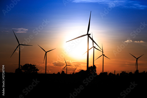 Wind turbines silhouette at sunset