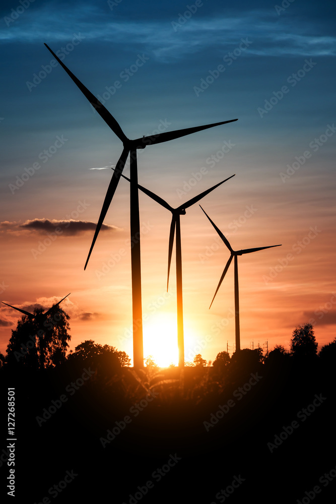 Wind turbines silhouette at sunset