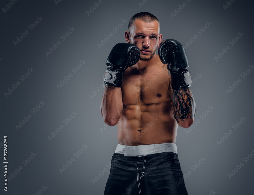 Obraz premium Brutal extreme fighter with tattoo on arms