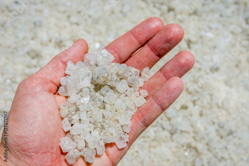 Holding salt crystals in hand