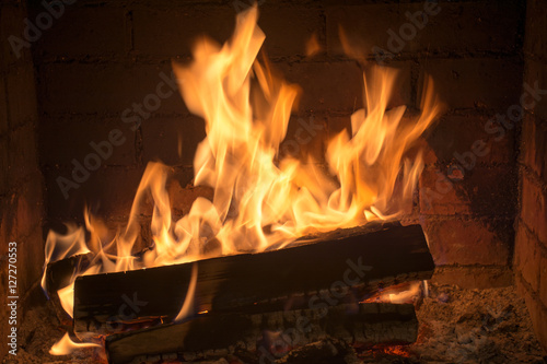 burning firewood in a fireplace