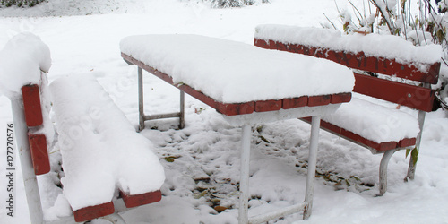 the bench and table in the snow