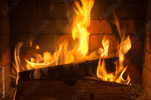 burning firewood in a fireplace