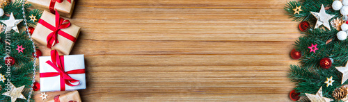 Christmas wooden background banner with tree, gift and decoratio